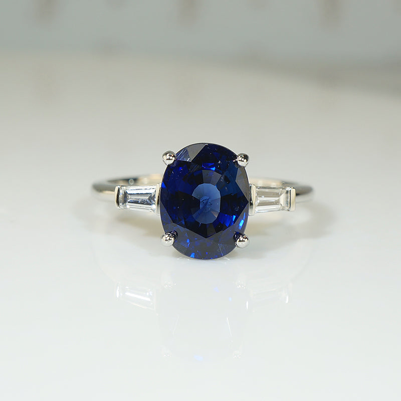 Deep Blue Oval Sapphire and Diamond Platinum Engagement Ring