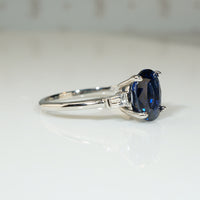 Deep Blue Oval Sapphire and Diamond Platinum Engagement Ring