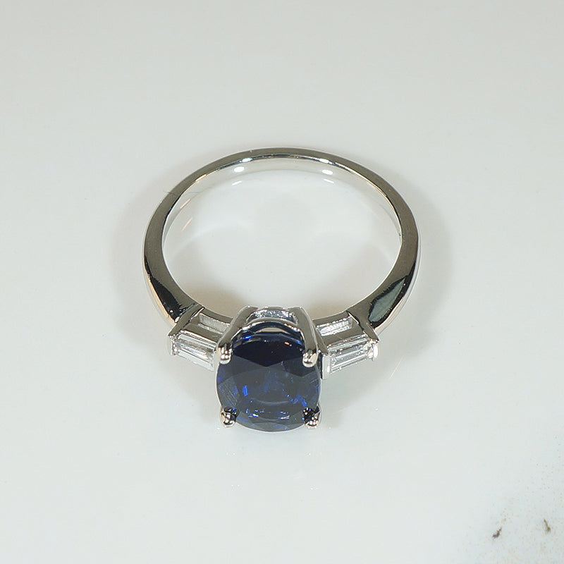 Deep Blue Oval Sapphire and Diamond Platinum Engagement Ring