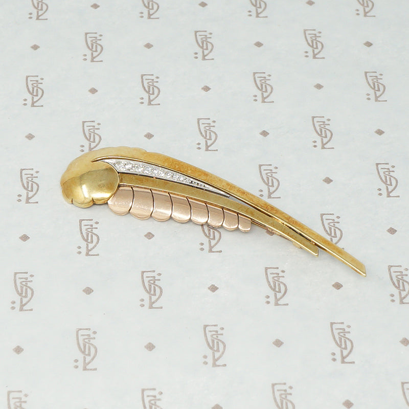 retro brooch in the shape of a birds wing with diamonds