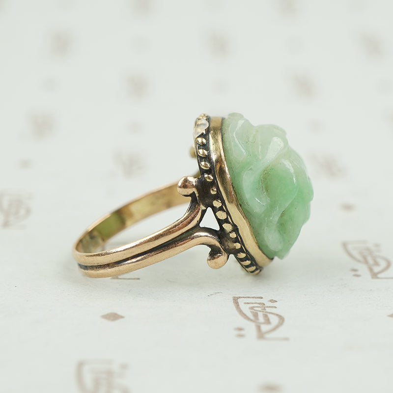 side detail of carved light green jade scarab ring