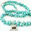 Long strand of Natural Turquoise Nuggets with a Large Silver Cross