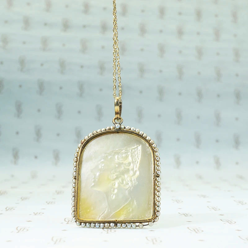 Carved mother of pearl "Rosario" pendant with seed pearl surround and rose cut diamond detailssilver and 14k yellow gold