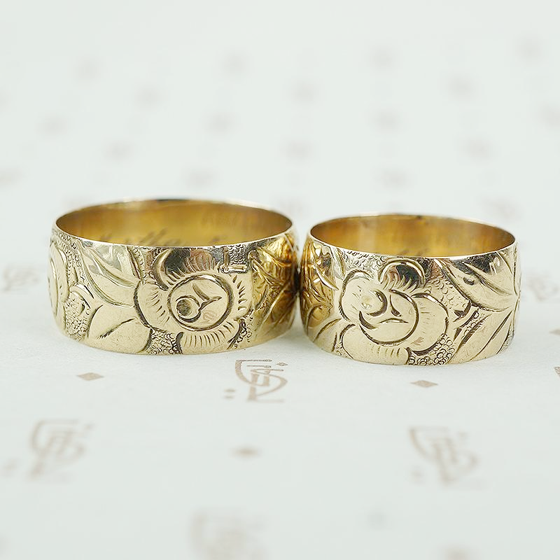matched pair of wedding bands with roses