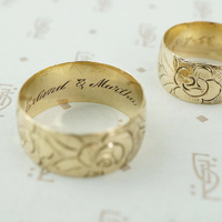 matched pair of wedding bands with roses