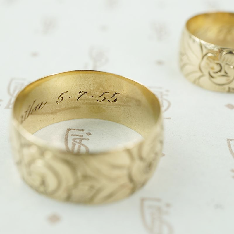 matched pair of wedding bands with roses