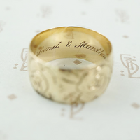 matched pair of wedding bands with roses