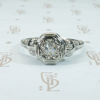 rose cut diamond in 18k white gold filigree ring