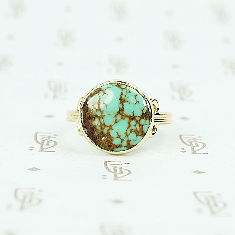 round turquoise in 14k gold specimen ring