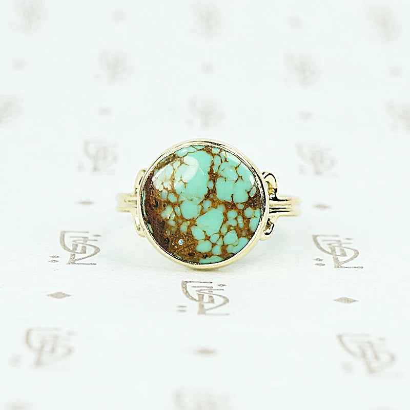 round turquoise in 14k gold specimen ring