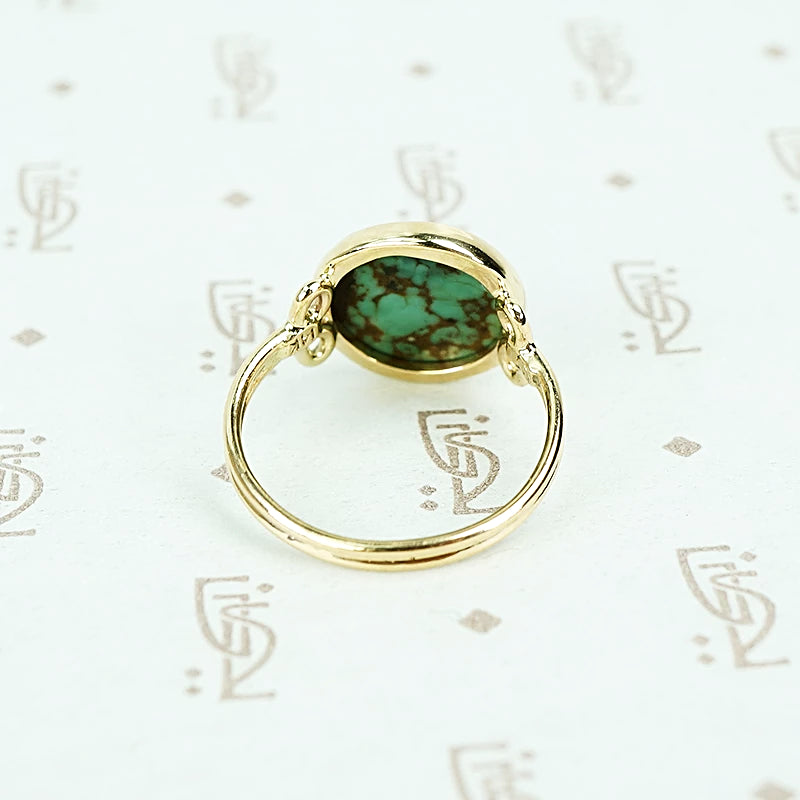 round turquoise in 14k gold specimen ring back view