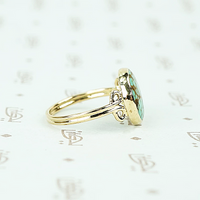 round turquoise in 14k gold specimen ring side view