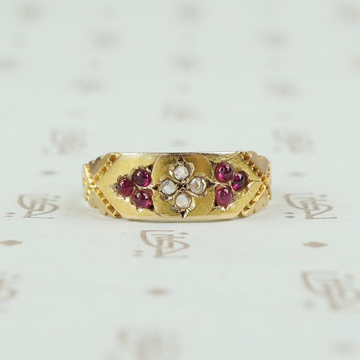 hallmarked 15ct gold band with diamonds and rubies