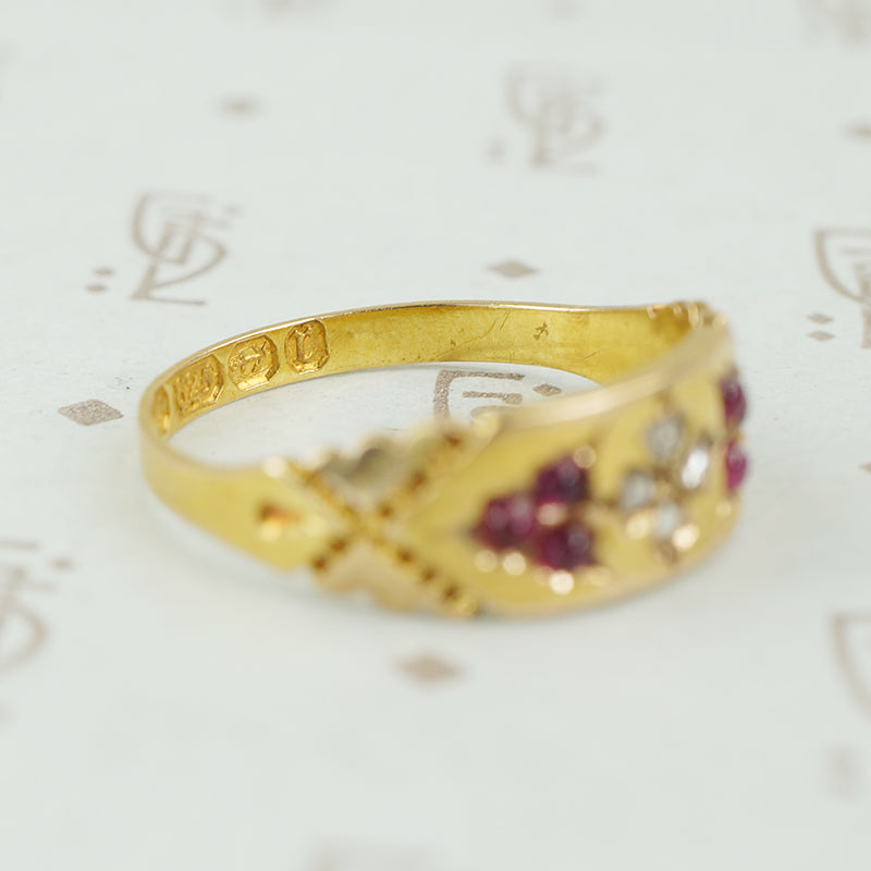hallmarked 15ct gold band with diamonds and rubies