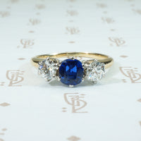 gorgeous cushion cut cornflower blue sapphire and 2 oec diamonds in platinum on 14k 3 stone ring