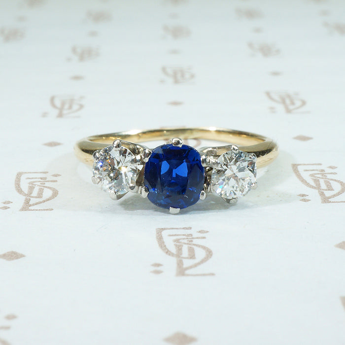gorgeous cushion cut cornflower blue sapphire and 2 oec diamonds in platinum on 14k 3 stone ring