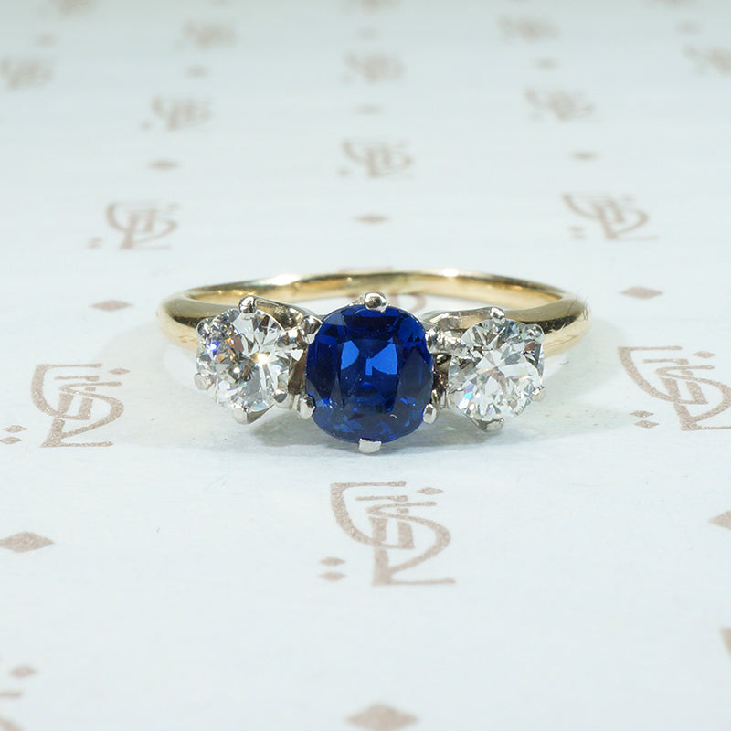 gorgeous cushion cut cornflower blue sapphire and 2 oec diamonds in platinum on 14k 3 stone ring