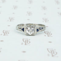 vintage white gold diamond engagement ring with sapphire sides