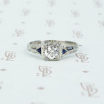 vintage white gold diamond engagement ring with sapphire sides
