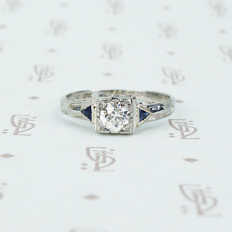 vintage white gold diamond engagement ring with sapphire sides