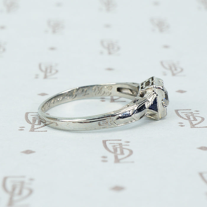 vintage white gold diamond engagement ring with sapphire sides