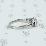 vintage white gold diamond engagement ring with sapphire sides