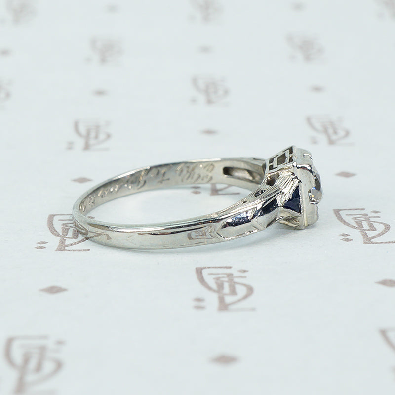 vintage white gold diamond engagement ring with sapphire sides