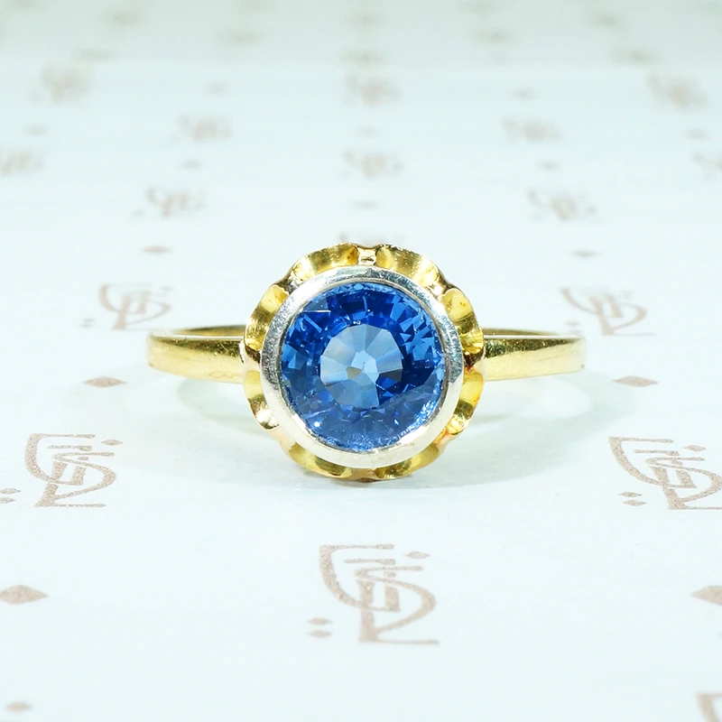 1.54 carat round indigo blue sapphire in 18k yellow gold and silver engagement ring