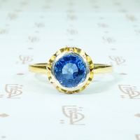 1.54 carat round indigo blue sapphire in 18k yellow gold and silver engagement ring