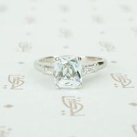 scissor cut aquamarine platinum engagement ring with baguettes