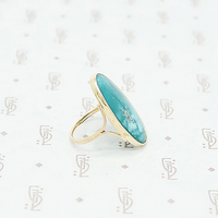 gold and turquoise ring side view