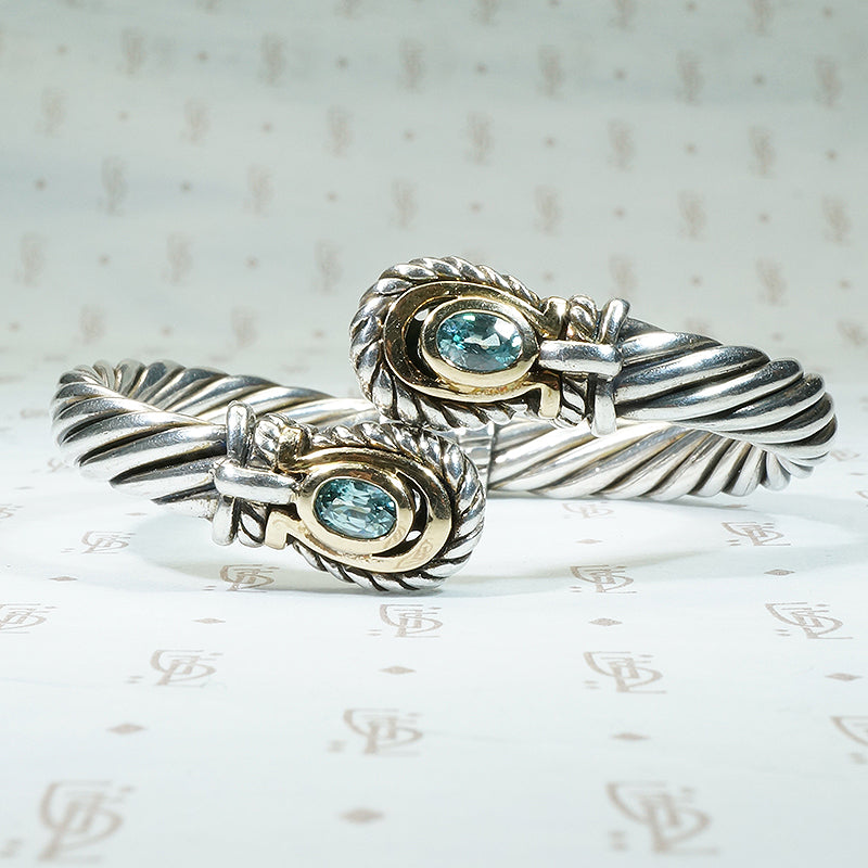 Samuel Benham sterling and 14k yellow gold clamper bracelet set with 2 oval natural blue zircons
