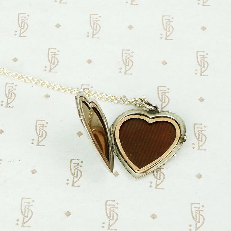Unusual Silver Heart Shaped Locket Gem Set