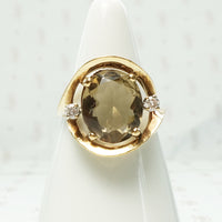 lovely bold oval smokey quartz and diamond ring in yellow gold circa 1960