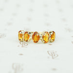 spesserite garnet 5 stone 18k recycled gold band