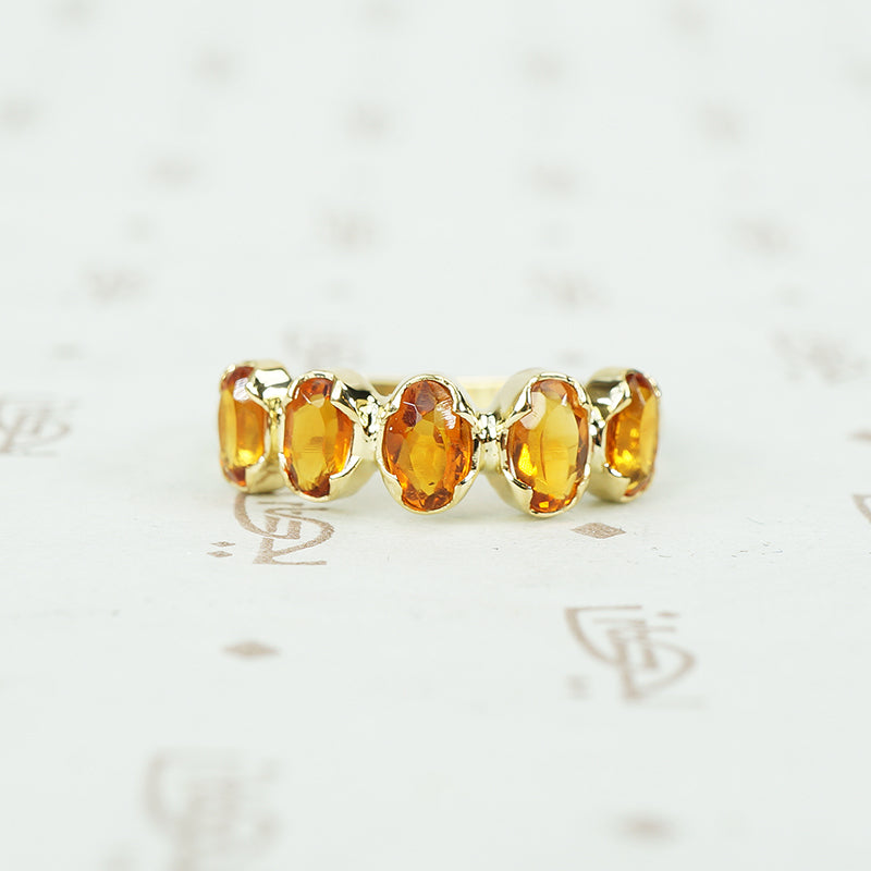 spesserite garnet 5 stone 18k recycled gold band