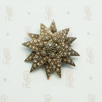 double stack gilded silver star brooch embellished with rivet like designs circa 1890