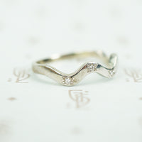 side view of star set 14k white gold recycled diamond wave band