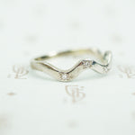 side view of star set 14k white gold recycled diamond wave band