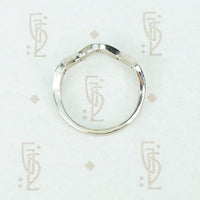 Flat side view of the recycled 14k white gold 5 diamond wave band showing flat back and wave front