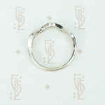 Flat side view of the recycled 14k white gold 5 diamond wave band showing flat back and wave front