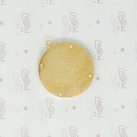 gübelin 18k sundial pendant back signature