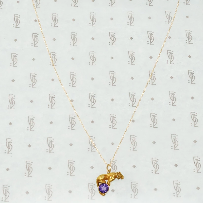 gold tiger on an amethyst ball alling & co