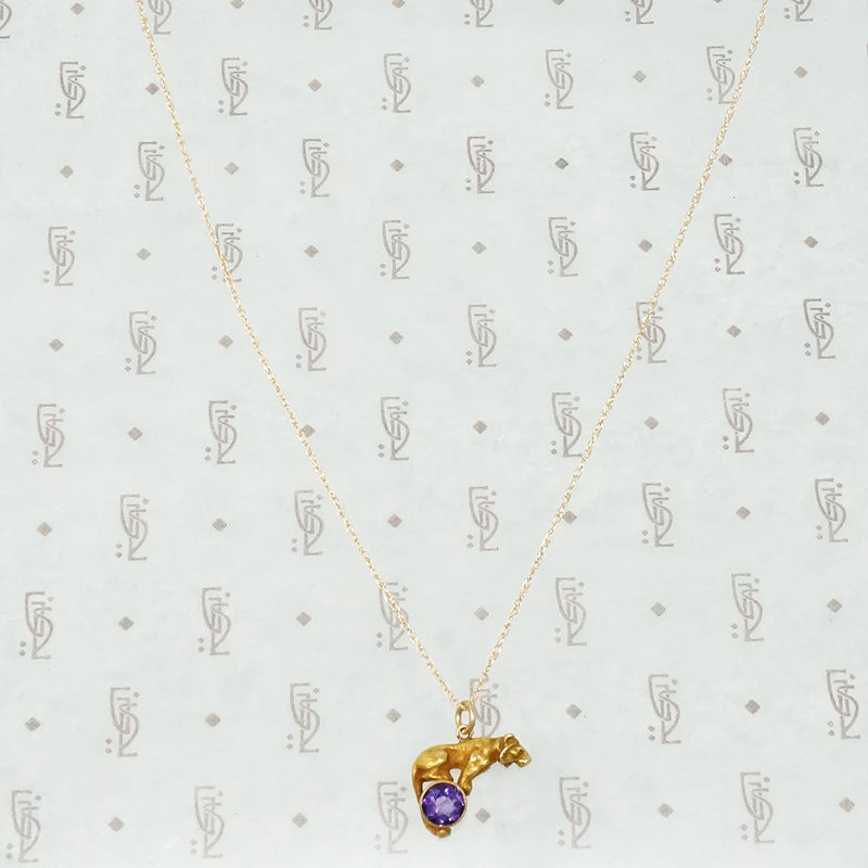 gold tiger on an amethyst ball alling & co