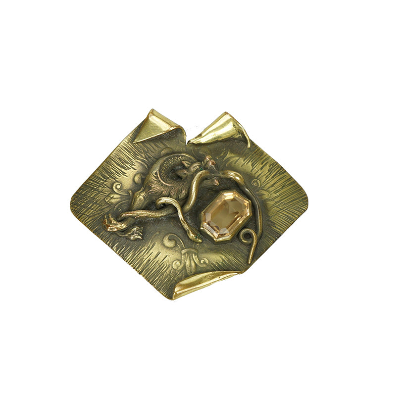 Large coat pin set with glass gem in the color of a citrine dragon and snake battle design