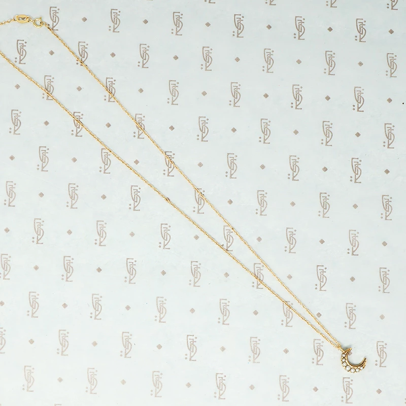 tiny gold crescent moon with pearls