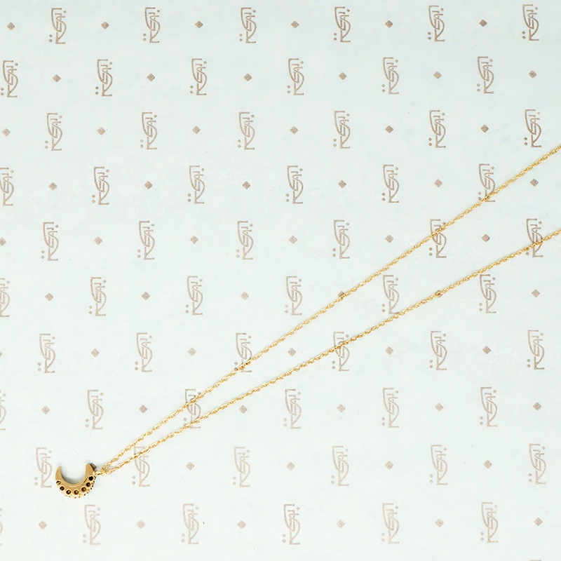 tiny gold crescent moon with pearls