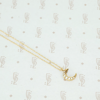 tiny gold crescent moon with pearls