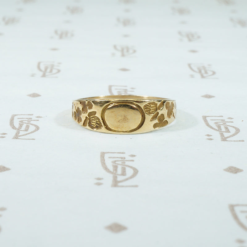 tiny 10k yellow gold signet ring with clover design