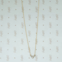 repourposed white gold diamond set triangle pendant on a recycled 14k yellow gold chain